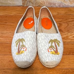 Tan and white Michael Kors slip on espadrilles